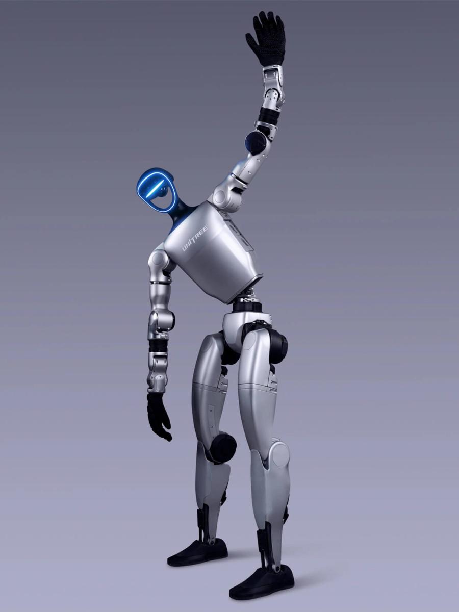 Unitree Robotics' G1 bipedal humanoid robot reaches a black gloved 5 digit hand up high as if stretching.