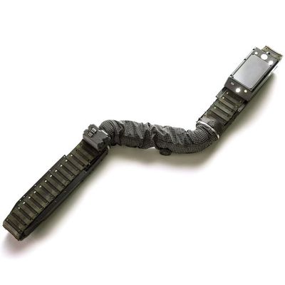 A black snake shaped robot crawls on a white surface.