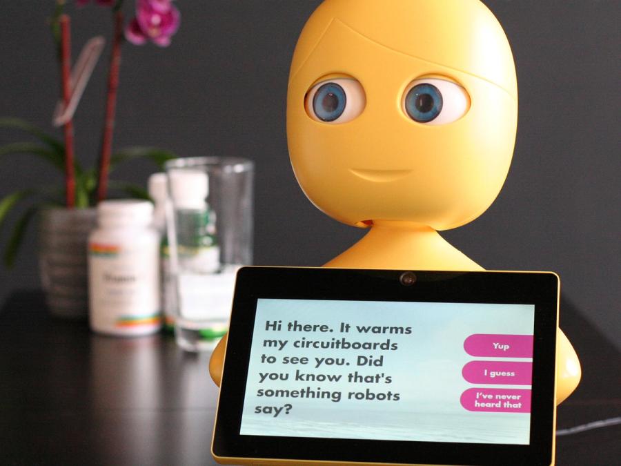 Mabu's tablet screen says "Hi there. It warms my circuitboards to see you. Did you know that's something robots say?"