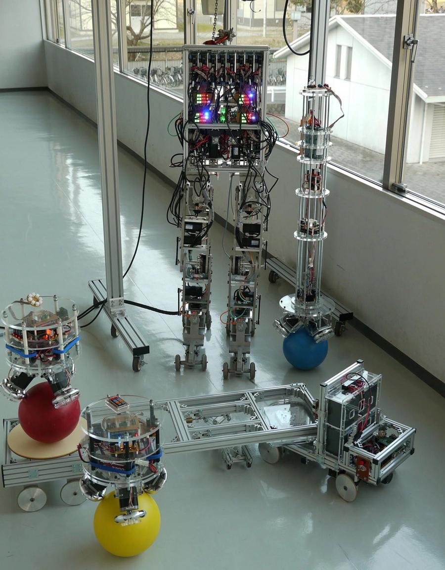 3 robots with balls for bases, one with two legs, and one with wheels.