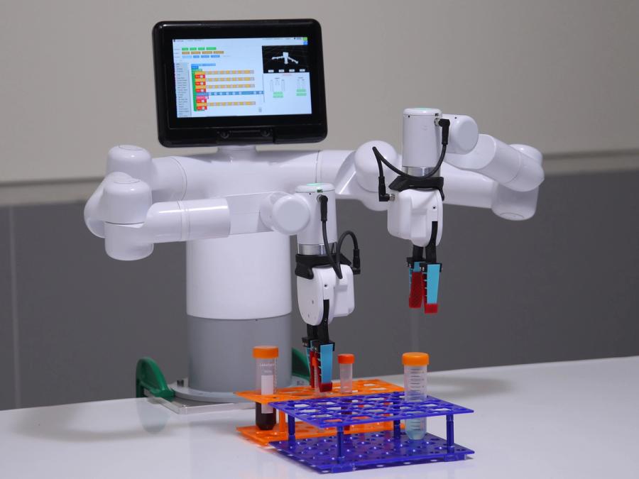 Mercury X1, a humanoid robot with two robotics arms uses grippers to manipulate test tubes.